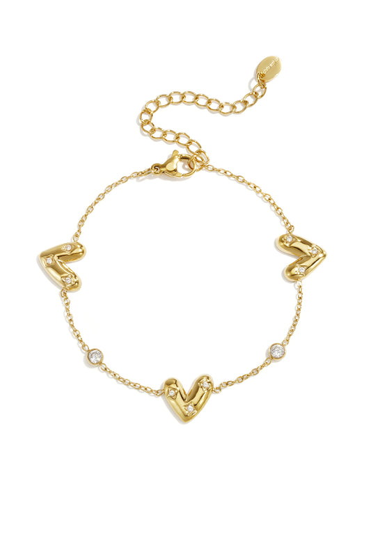 Armband met drie belegde harten en ronde zirkonia steentjes