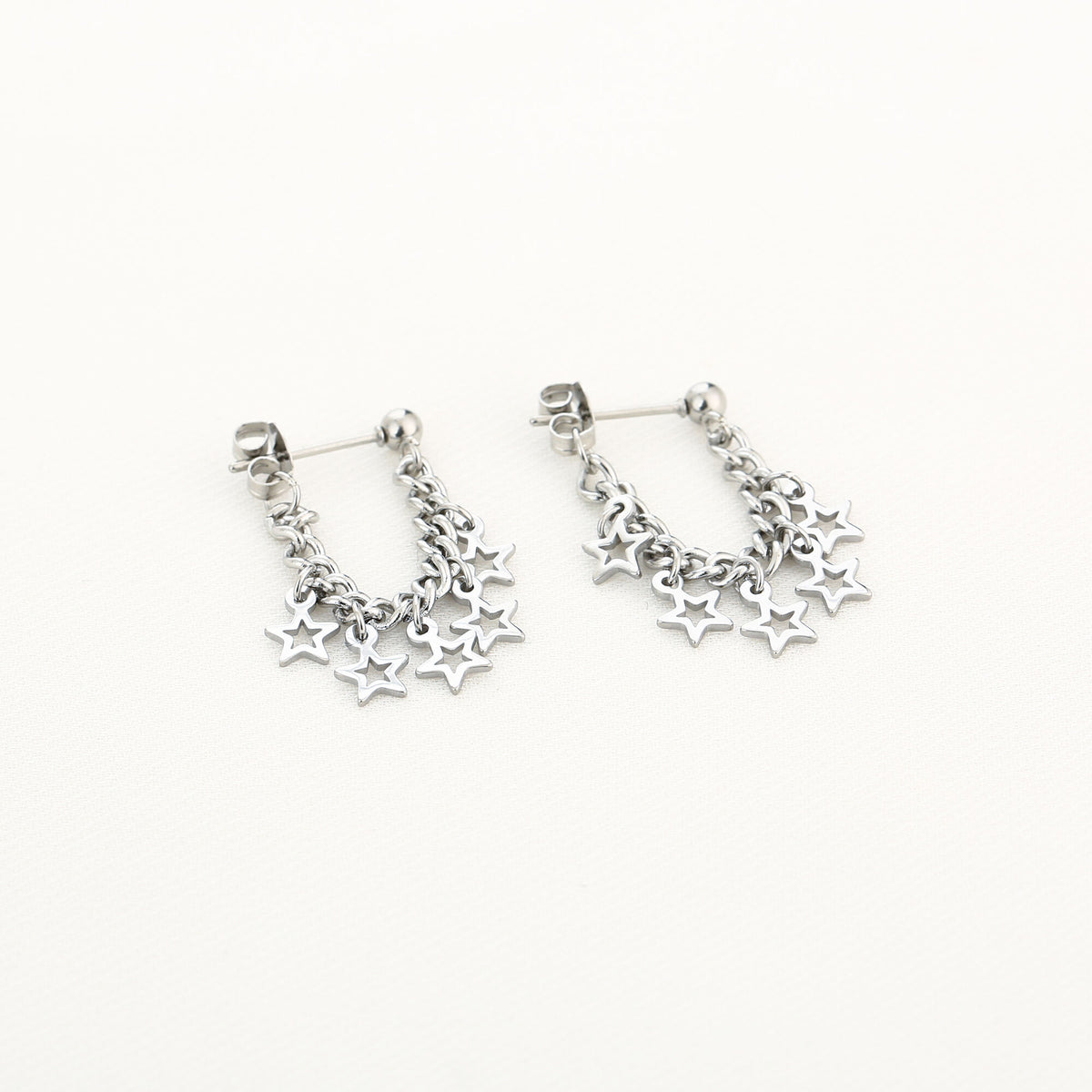 HZ Sterrendans oorbellen – zilverkleurig stainless steel met kettinkje