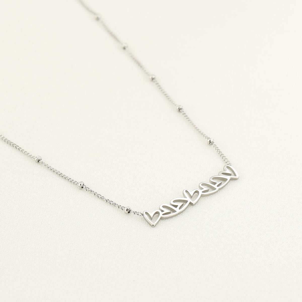 HZ Ketting 7 hartjes - stainless steel zilver of goud